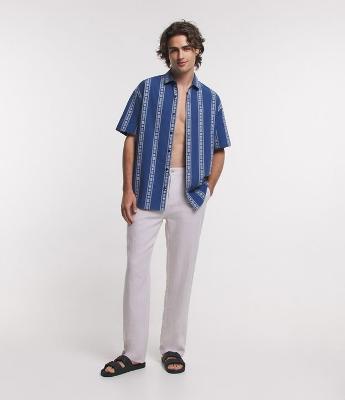 Calça em Linho com Bolsos Faca e Lapela