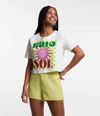 Blusa T-shirt em Algodão com Fundo Quadriculado e Estampa Raio de Sol