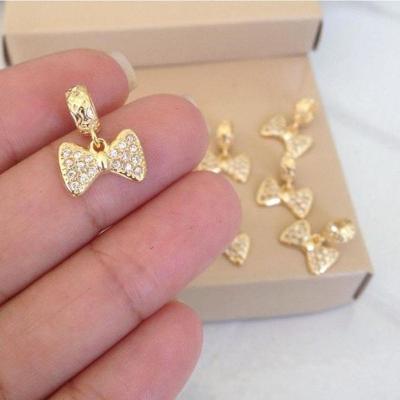 Pingente De Berloque Laço Pedras Cristal Banhado A Ouro